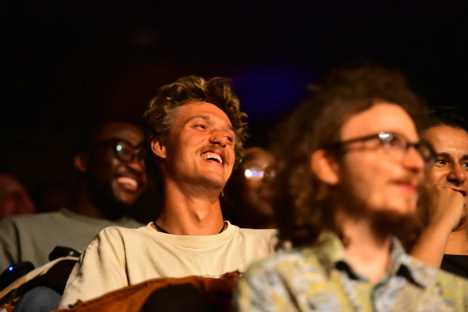 OPEK audience laughing during an English stand-up show