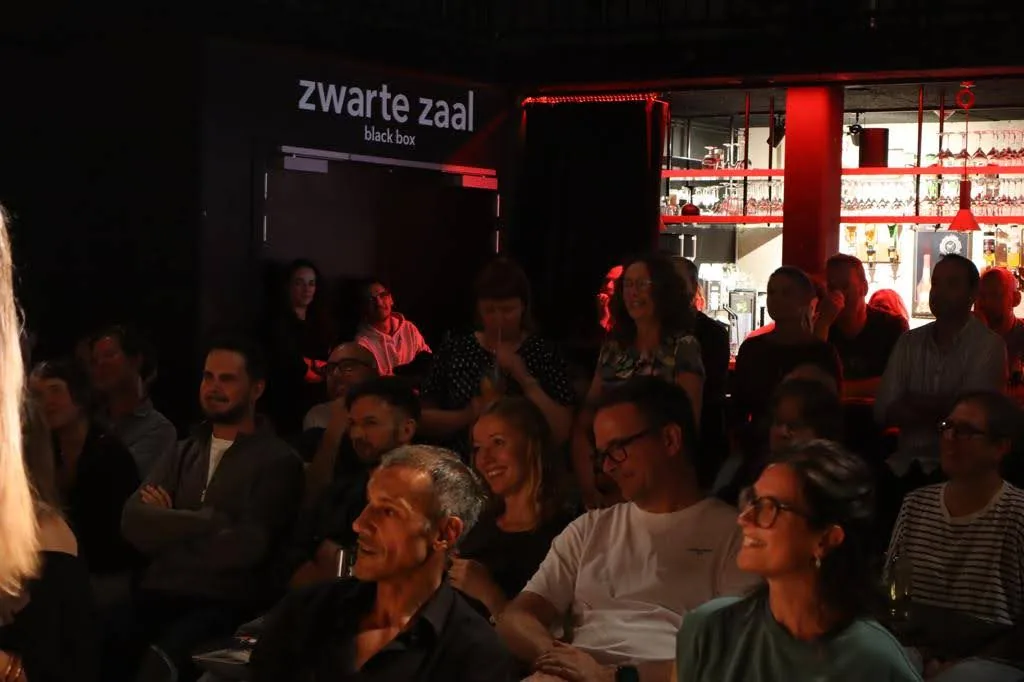 The seated audience watching a performance at MUZEcafé in Heusden-Zolder.