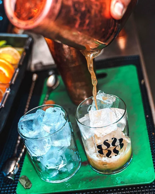 Cocktails being poured over ice at the Vertigo bar.